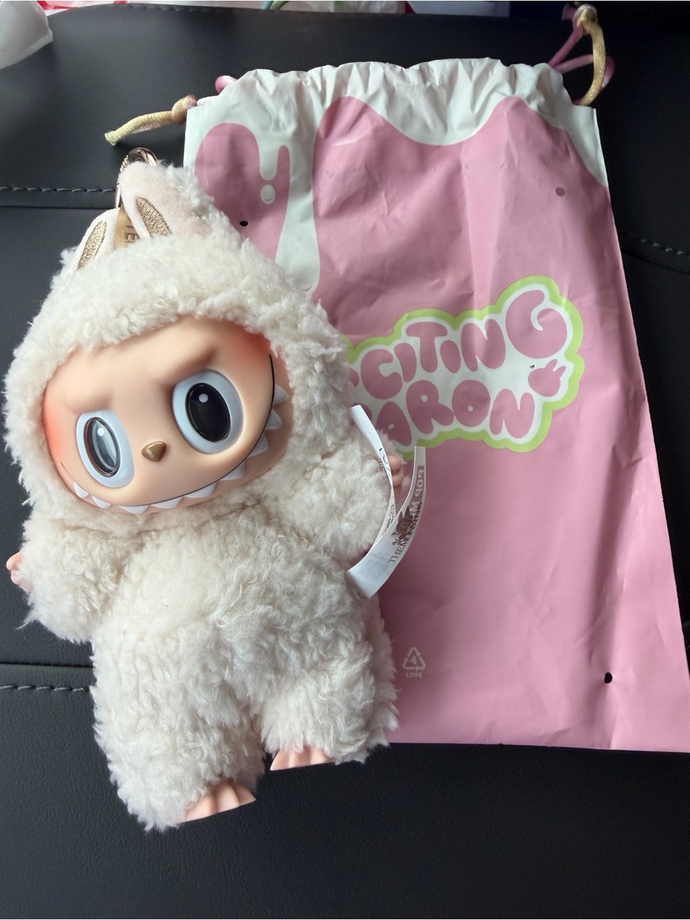 Labubu from pop mart Cute Fluffy Creature Plush Doll in Cream with Pink Accents